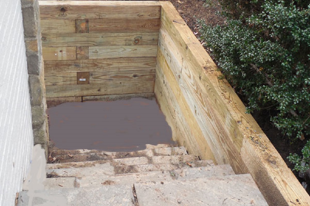 Pressure-treated wood retaining wall